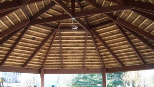 Commercial wooden gazebo providing outdoor shelter.