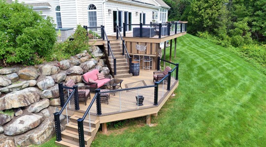 New Jersey multi-tier custom-built deck with upgraded safety railings and built in seating