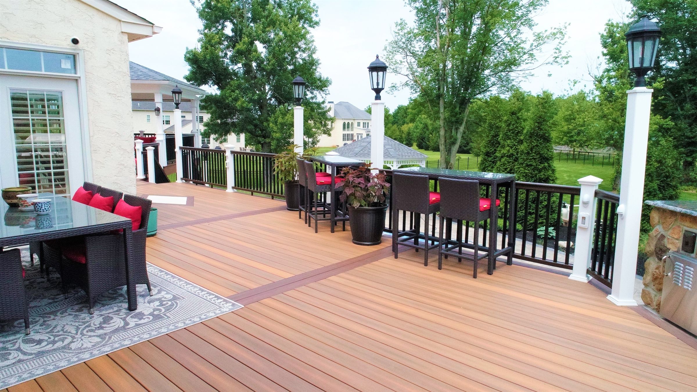 Composite deck with a gazebo and lounge seating