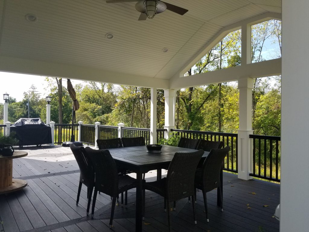 Covered deck under a vaulted gable roof with open views