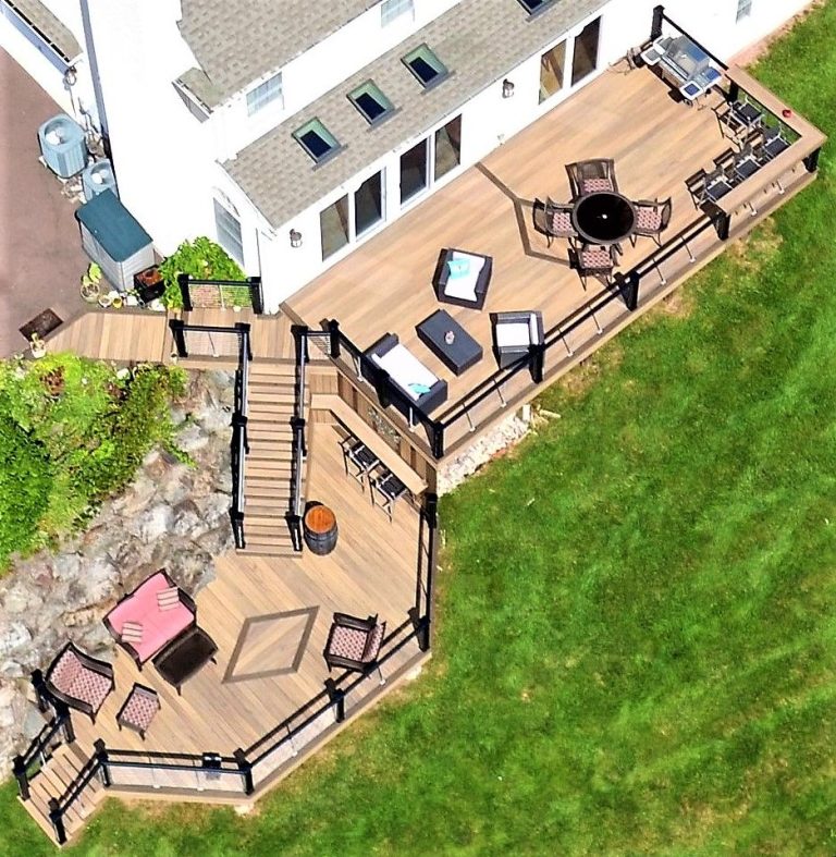 Aerial view of a multi-level deck built against a stone wall