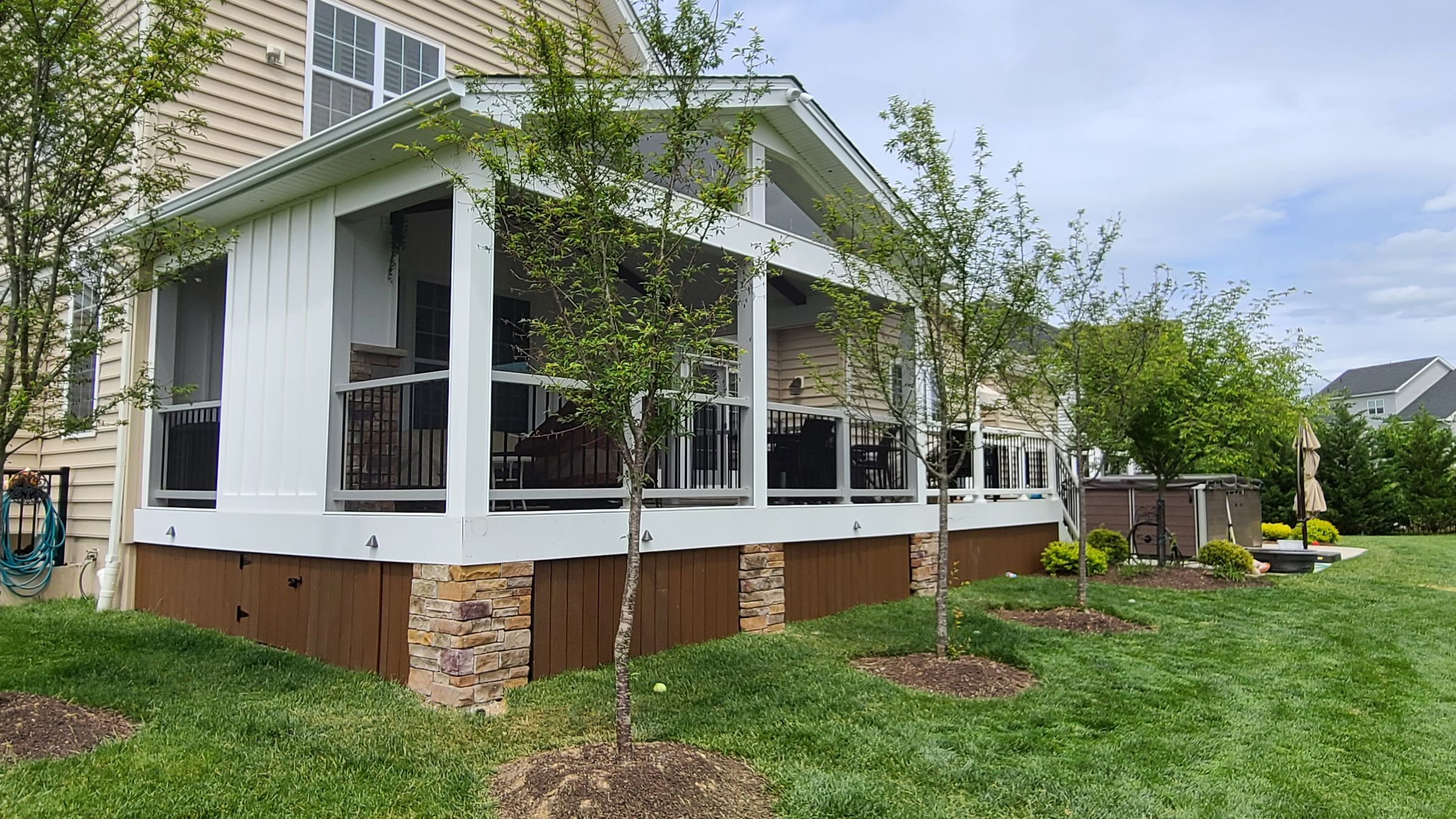 Screened porch built onto the back of a home